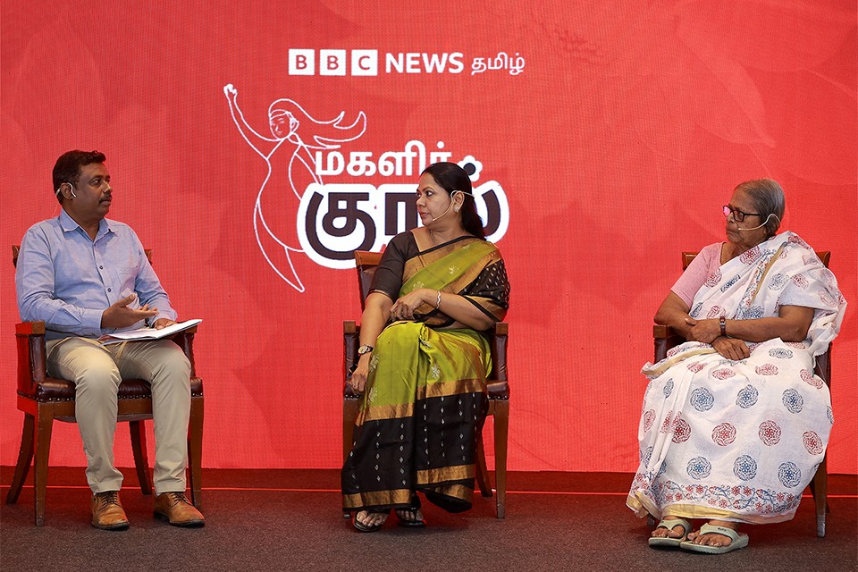 CNR representative in conversation with guests on stage
